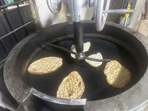 Bread being toasted after the terebinth roast