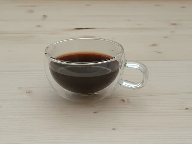 Glass cup of NooTea brewed Americano-style with more volume