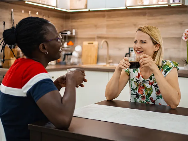 Home kitchen brewing scene with friends enjoying NooTea